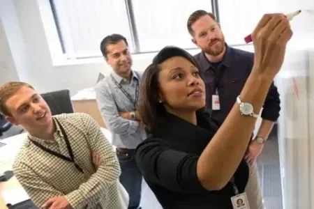 Person drawing on whiteboard