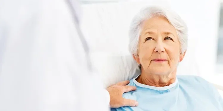 elderly lady lying in a bed