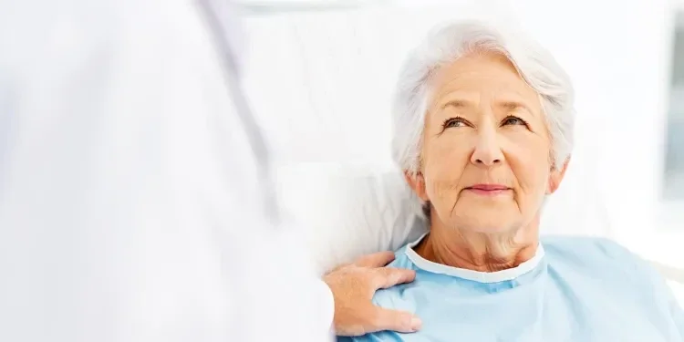 elderly lady lying in a bed
