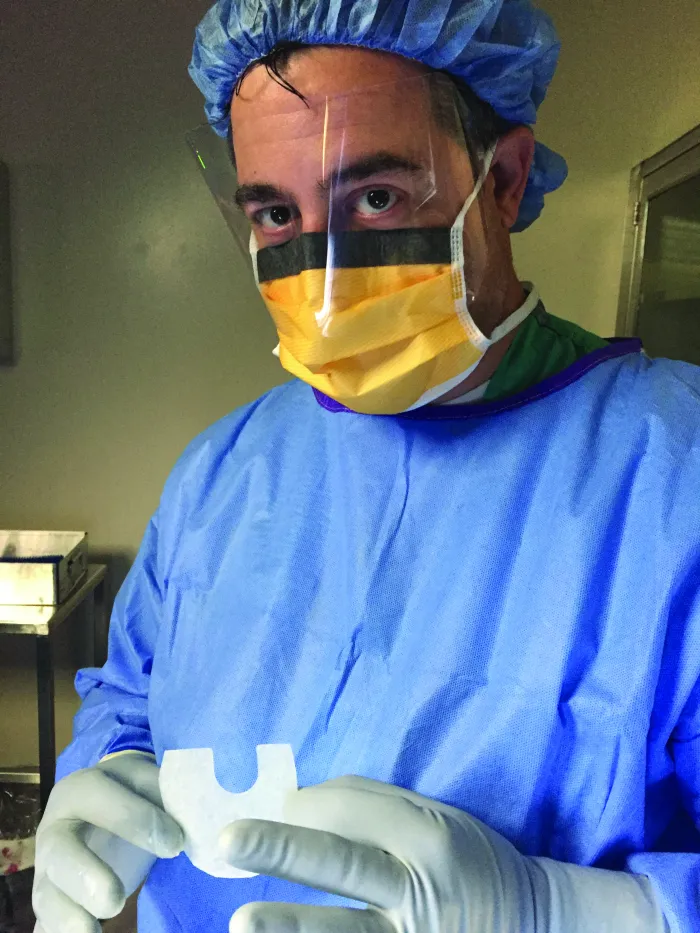 Surgeon holding GORE® BIO-A® Tissue Reinforcement
