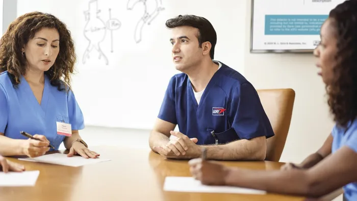 Physicians sitting at table