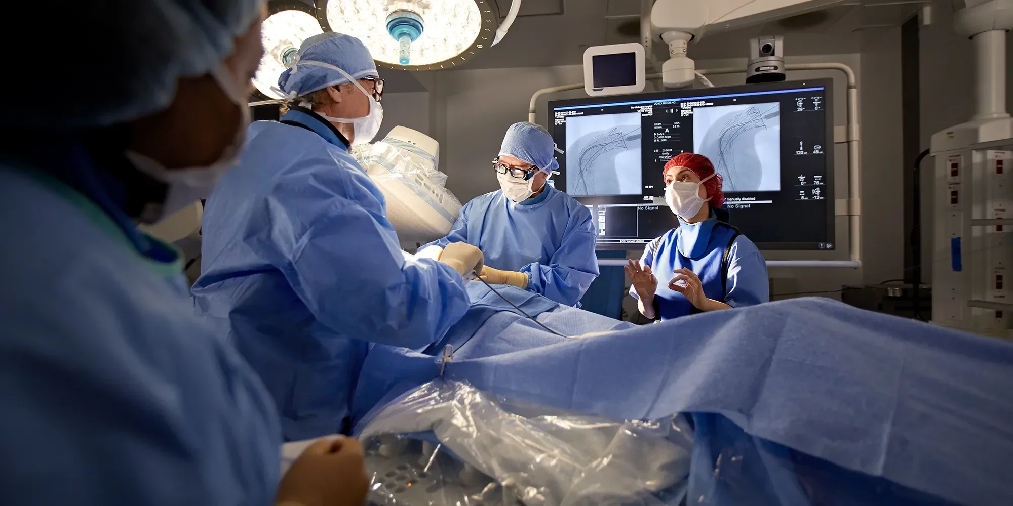 image of doctors performing a procedure in an operating room