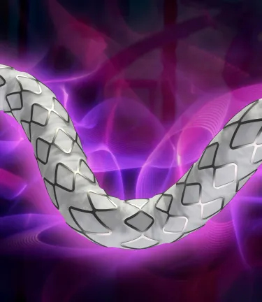 Product shot of the GORE® VIABAHN® VBX Balloon Expandable Endoprosthesis surrounded by a purple and pink glow over a dark background