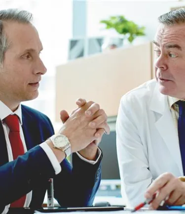 Two health professionals talking