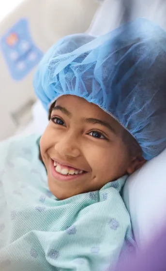 close up of little girl in hospital smiling