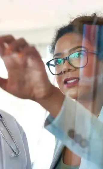 Man and woman looking at screen