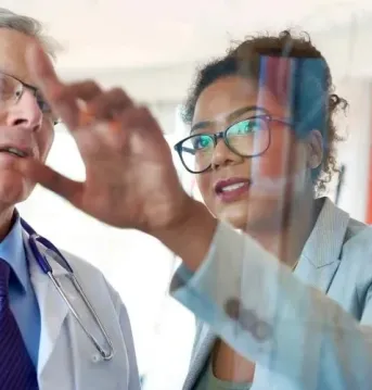 Man and woman looking at screen