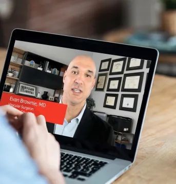 Health care professional viewing a webinar about building an aortic program